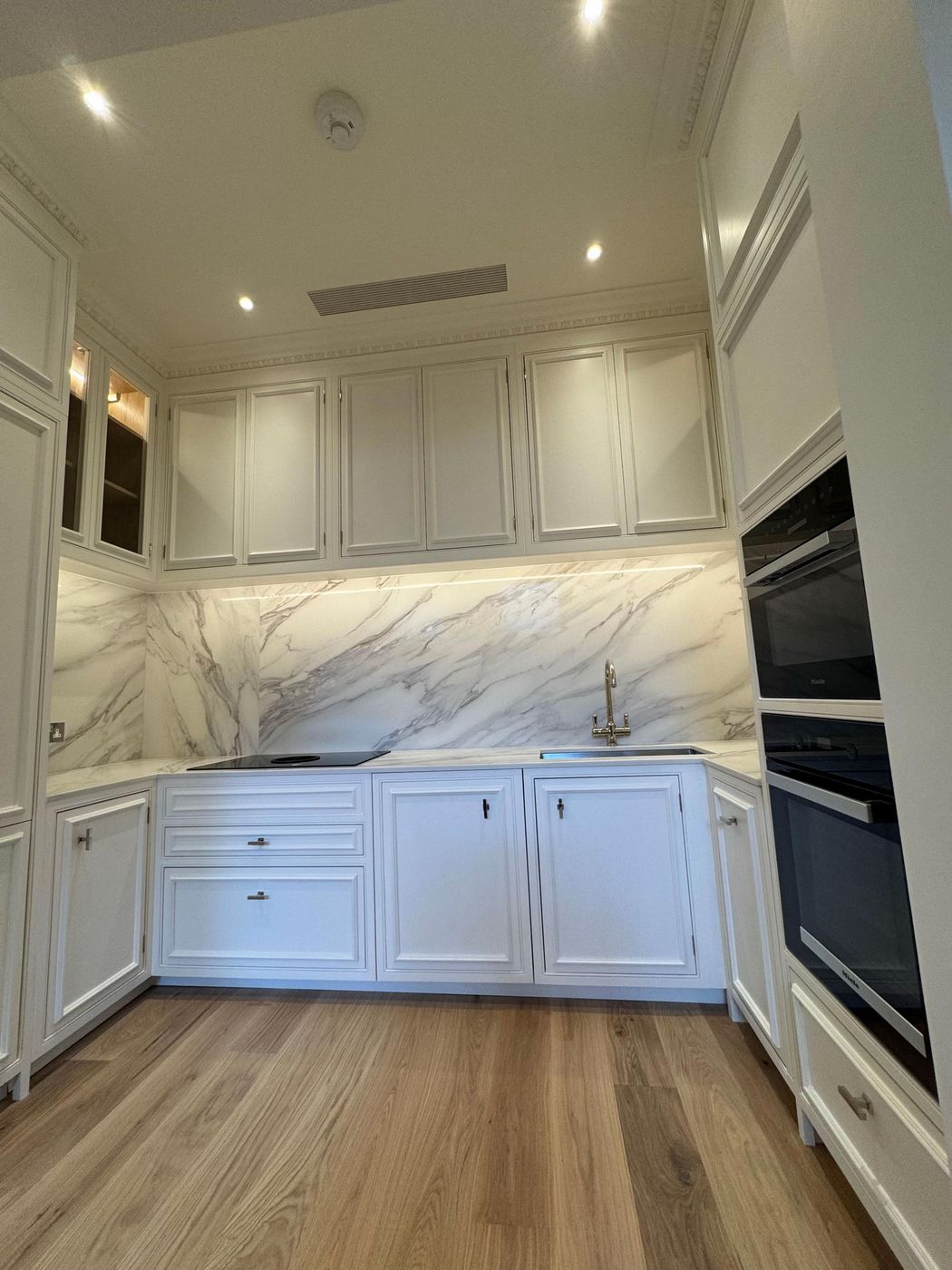 Refurbished period room with marble splashback kitchenette